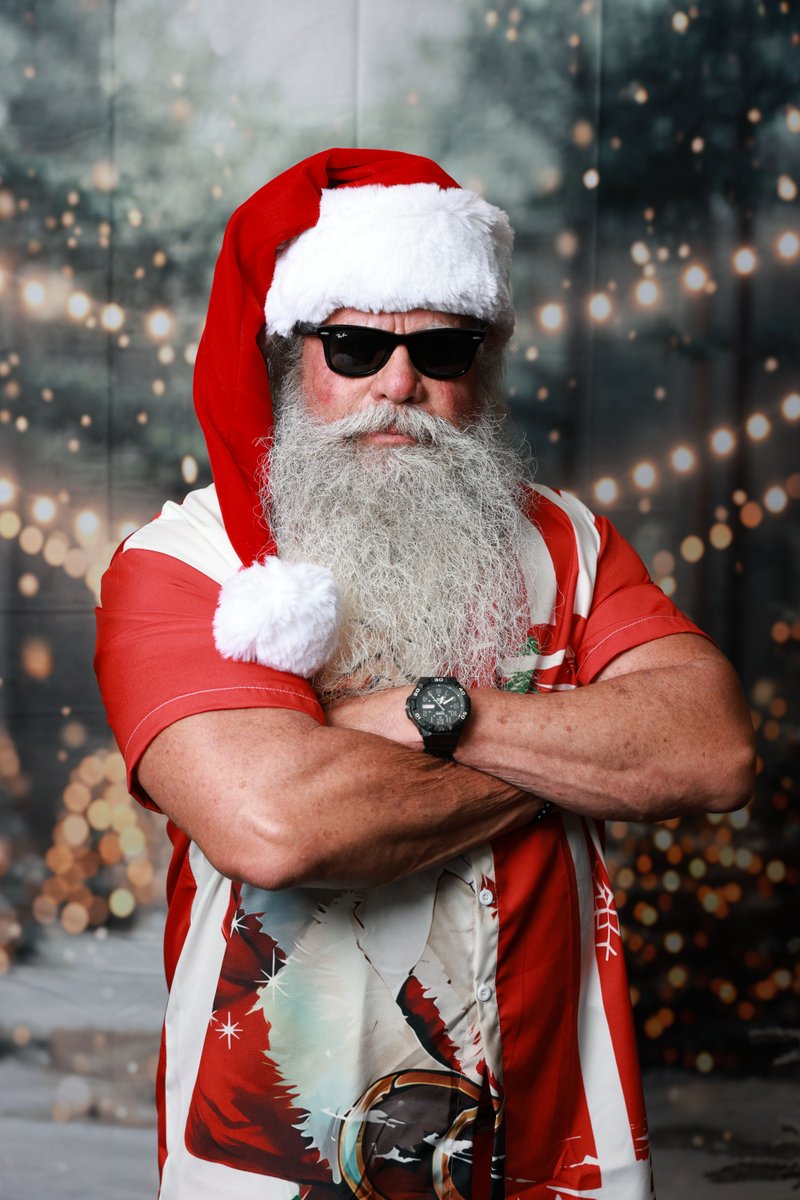 Santa Steve laughing with guests by the water